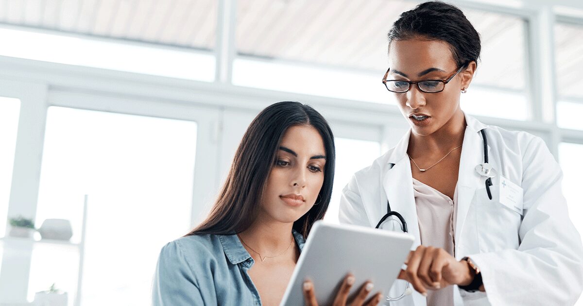 Healthcare professional discussing medical abortion information with patient