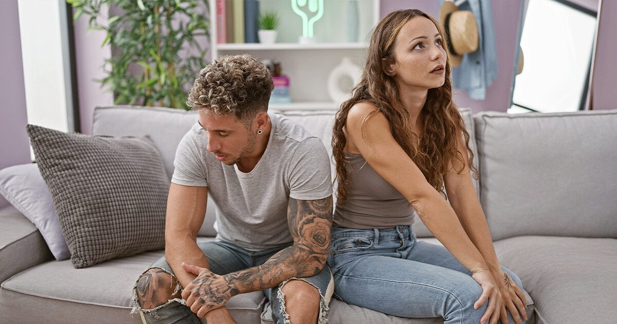 Distressed woman feeling pressured by her partner to have an abortion.